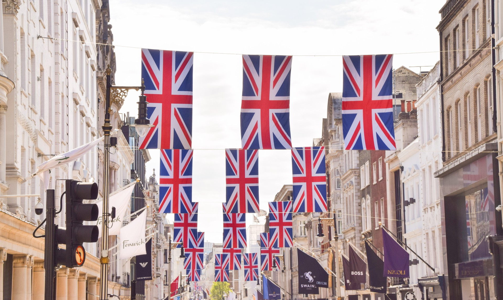 New Bond Street with Union Jack flags and banners, London, UK